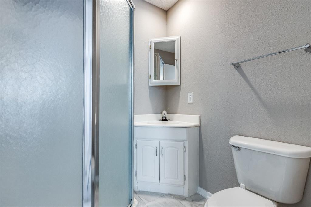312 Mockingbird Lane Denton, TX 76209 - Photo 20 of 25 Bathroom with ceramic tile flooring and shower.