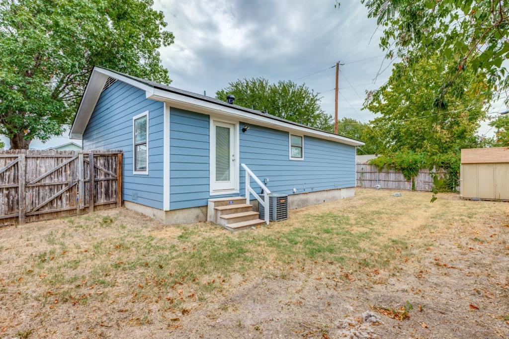 312 Mockingbird Lane Denton, TX 76209 - Photo 23 of 25 Back of home with a huge fenced in yard