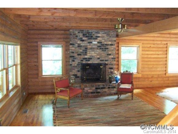 715 Pleasant Hill Road Landrum, SC 29356 - Photo 8 of 22 a living room with furniture and a fireplace