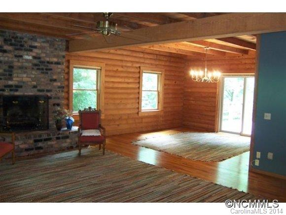 715 Pleasant Hill Road Landrum, SC 29356 - Photo 9 of 22 a view of empty room with wooden floor and fireplace