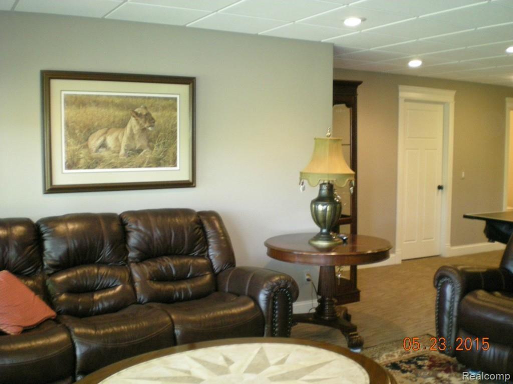 4200 Colonial Court Howell, MI 48843 - Photo 74 of 86 LL REC ROOM W DOOR WALLS TO PATIO