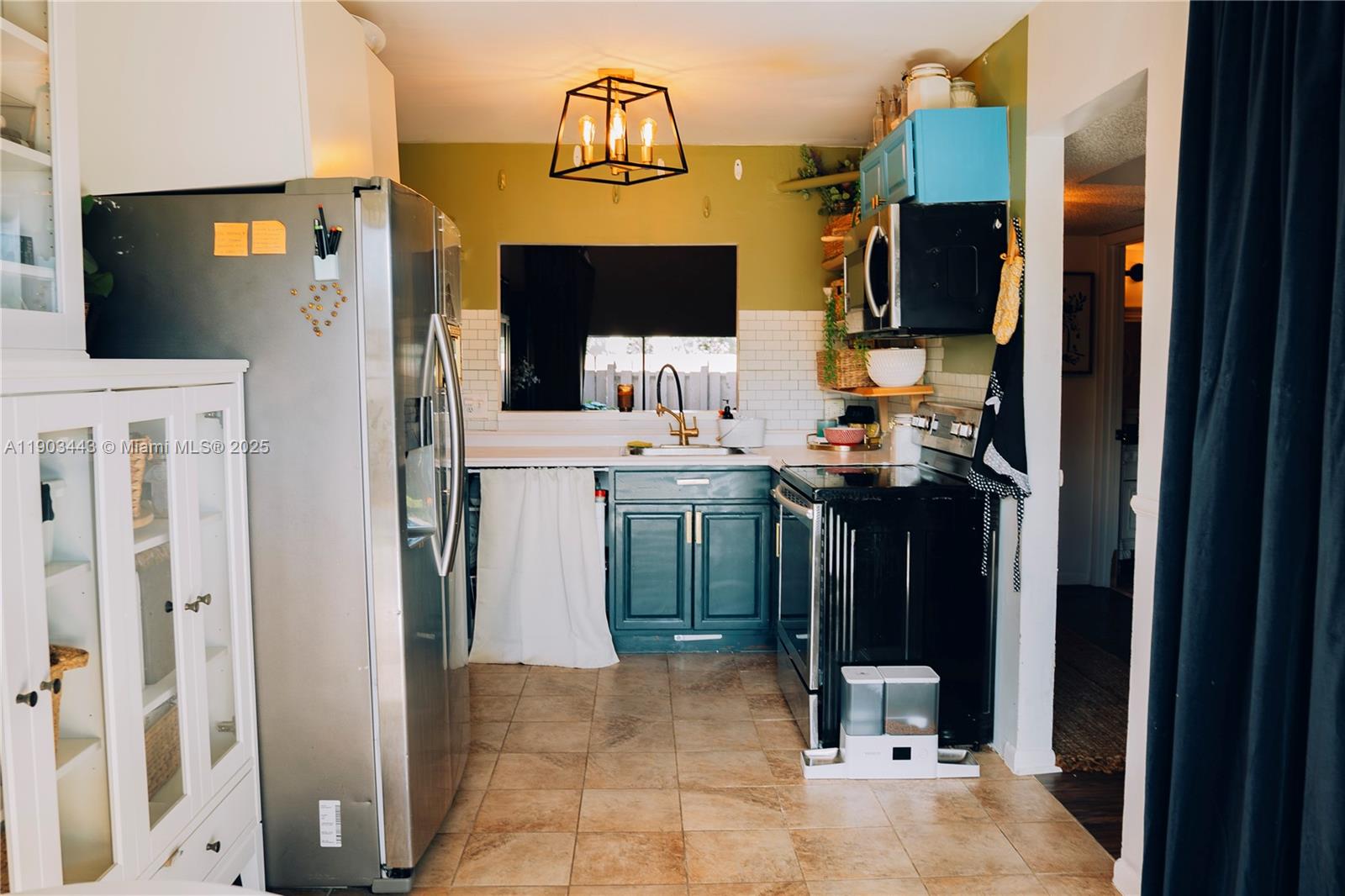 2152 Southwest 81st Way Davie, FL 33324 - Photo 13 of 27 a view of a kitchen from the living room
