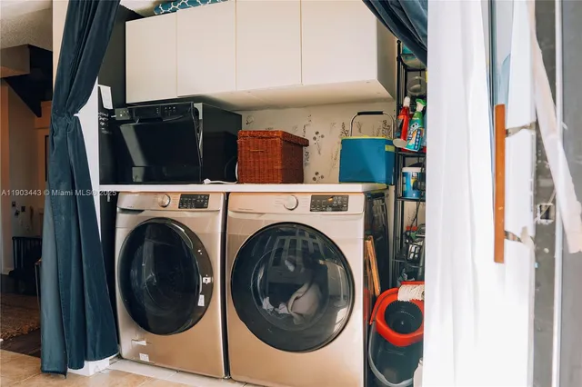a utility room with dryer and washer