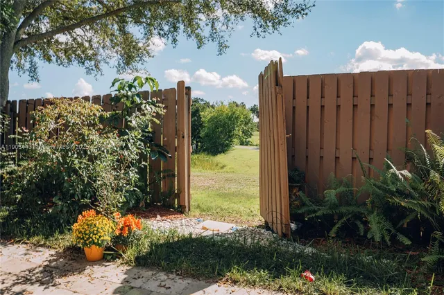 a view of a backyard of the house