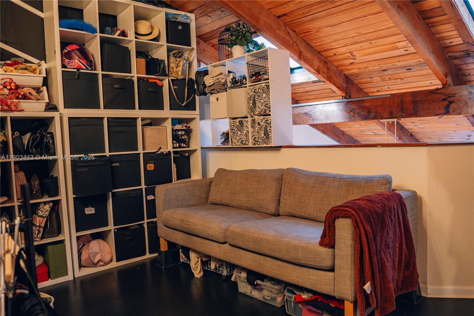 2152 Southwest 81st Way Davie, FL 33324 - Photo 23 of 27 a view of a living room with furniture and a book shelf