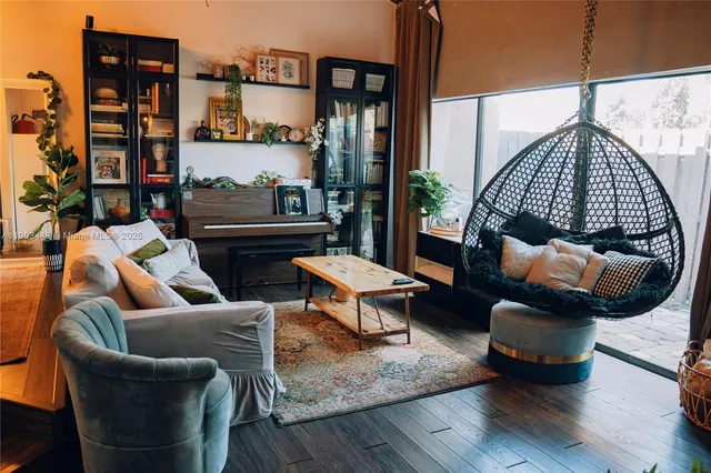 a living room with furniture rug and lamp
