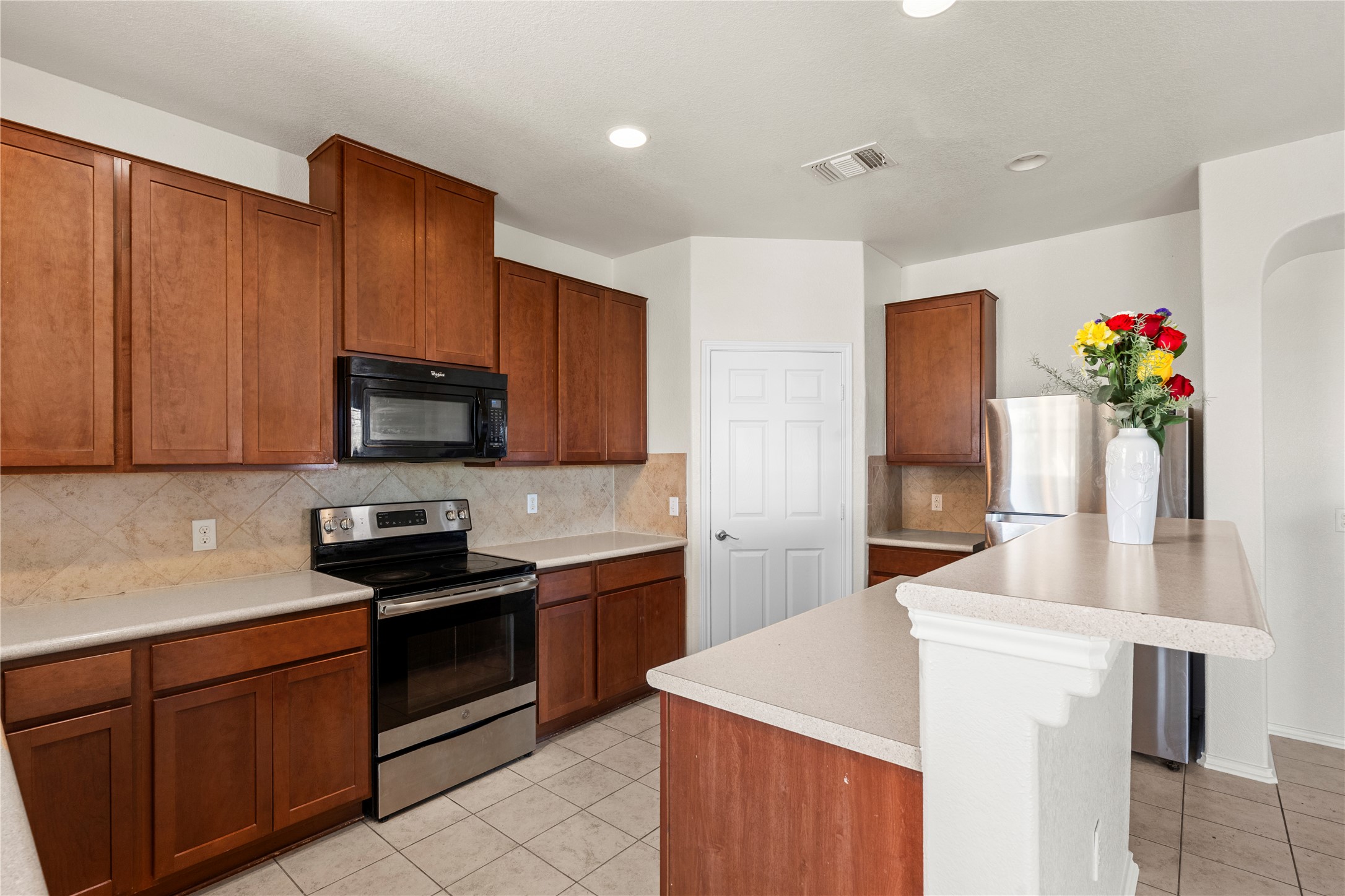 8613 Capitol View Drive Austin, TX 78747 - Photo 21 of 33 A well-appointed kitchen showcasing rich cabinetry and practical counter space, perfect for culinary endeavors.