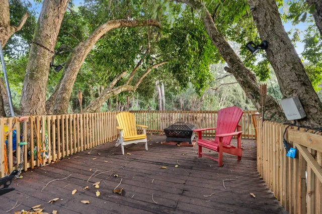 a backyard of a house with table and chairs