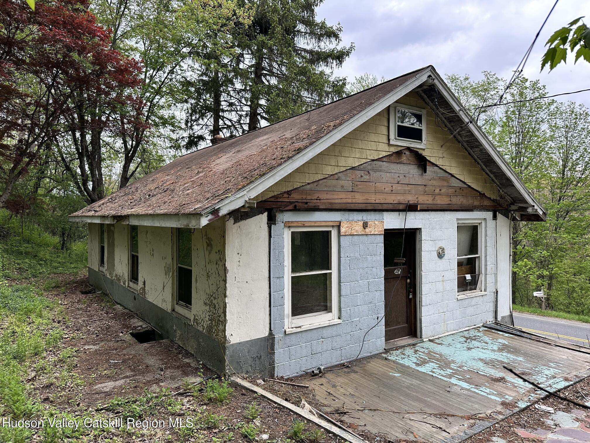 1033 Co Rte 8 Germantown, NY 12526 - Photo 7 of 14 a front view of a house with a garden
