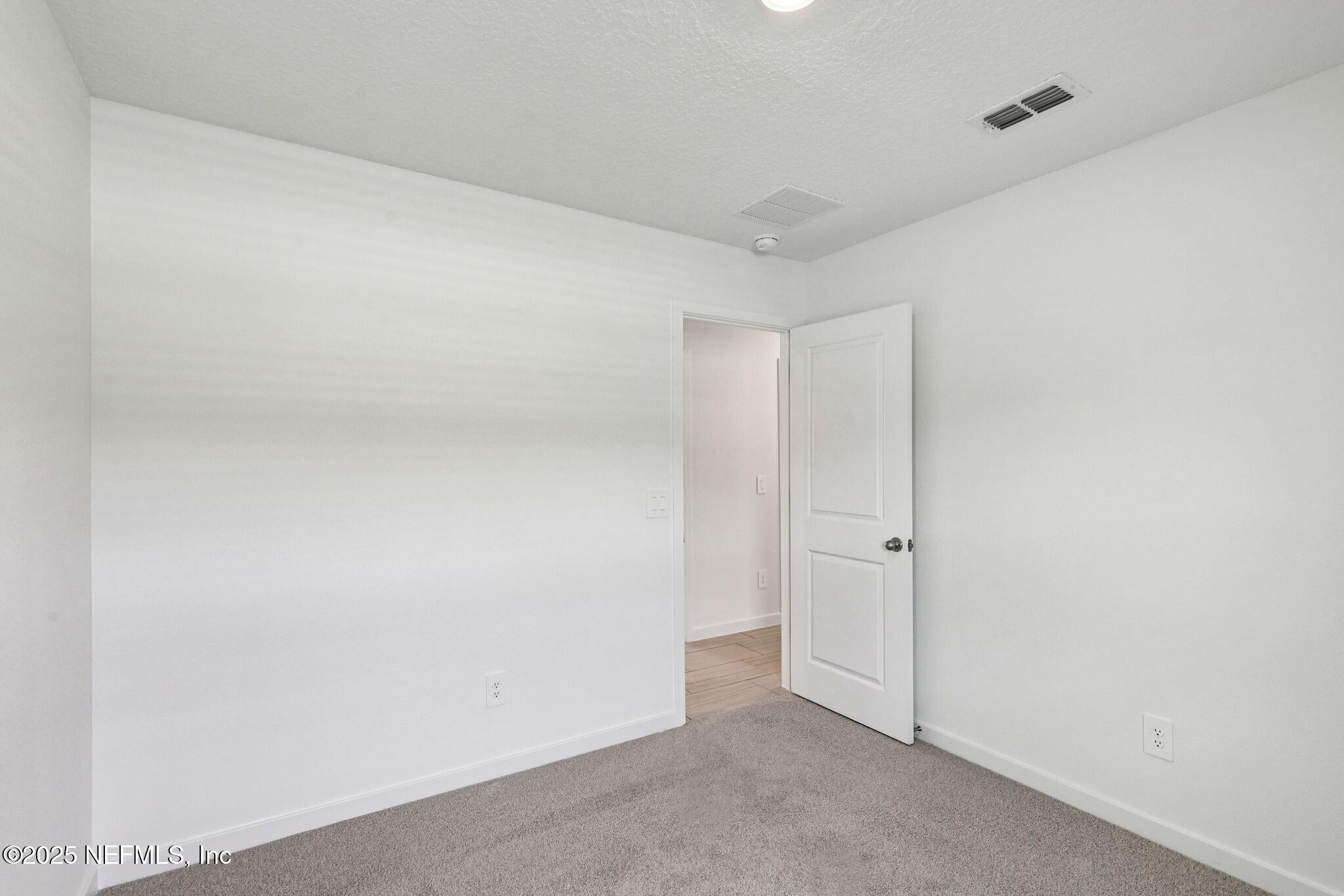 9709 Amber Vlg Road Jacksonville, FL 32219 - Photo 12 of 25 a view of an empty room