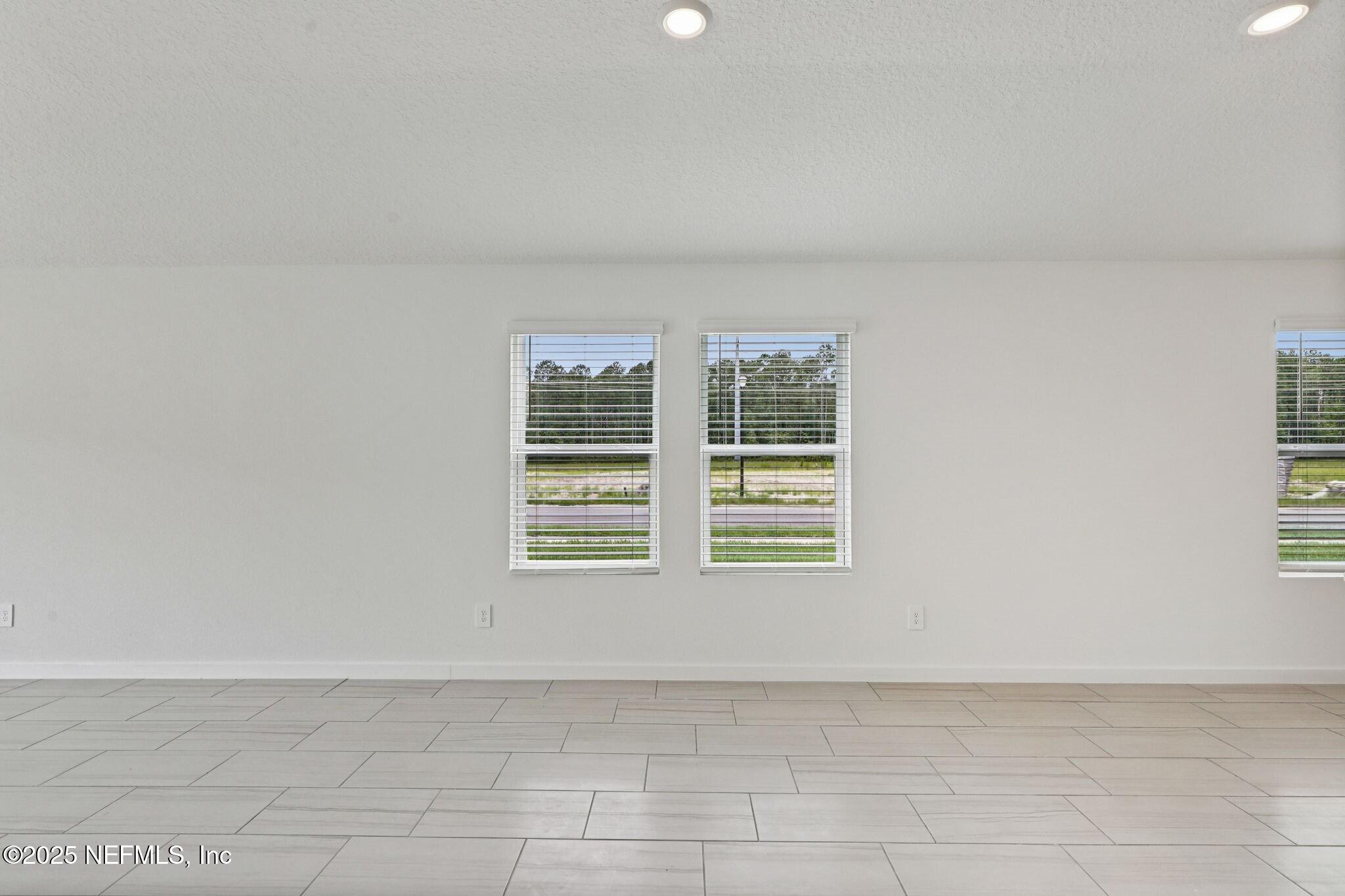 9709 Amber Vlg Road Jacksonville, FL 32219 - Photo 23 of 25 a view of an empty room with a window