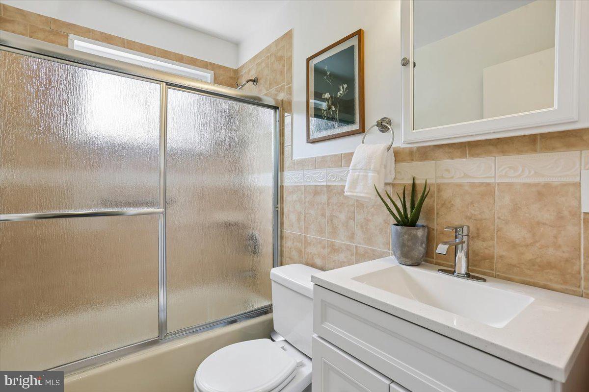 3709 Kenway Street Silver Spring, MD 20906 - Photo 23 of 34 a bathroom with a sink and a shower