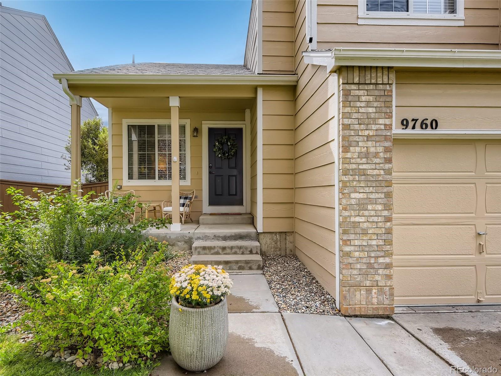 9760 South Castle Ridge Circle Highlands Ranch, CO 80129 - Photo 2 of 25 a front view of a house