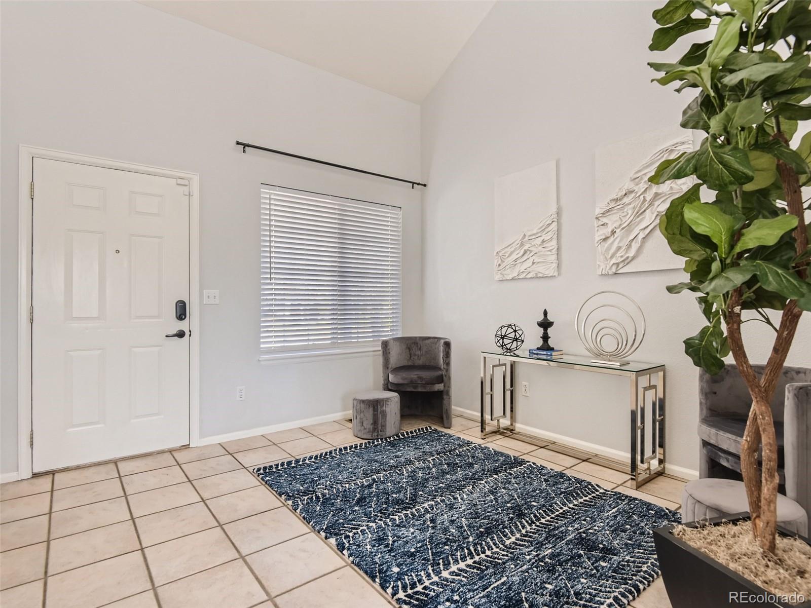 9760 South Castle Ridge Circle Highlands Ranch, CO 80129 - Photo 5 of 25 a living room with a couch