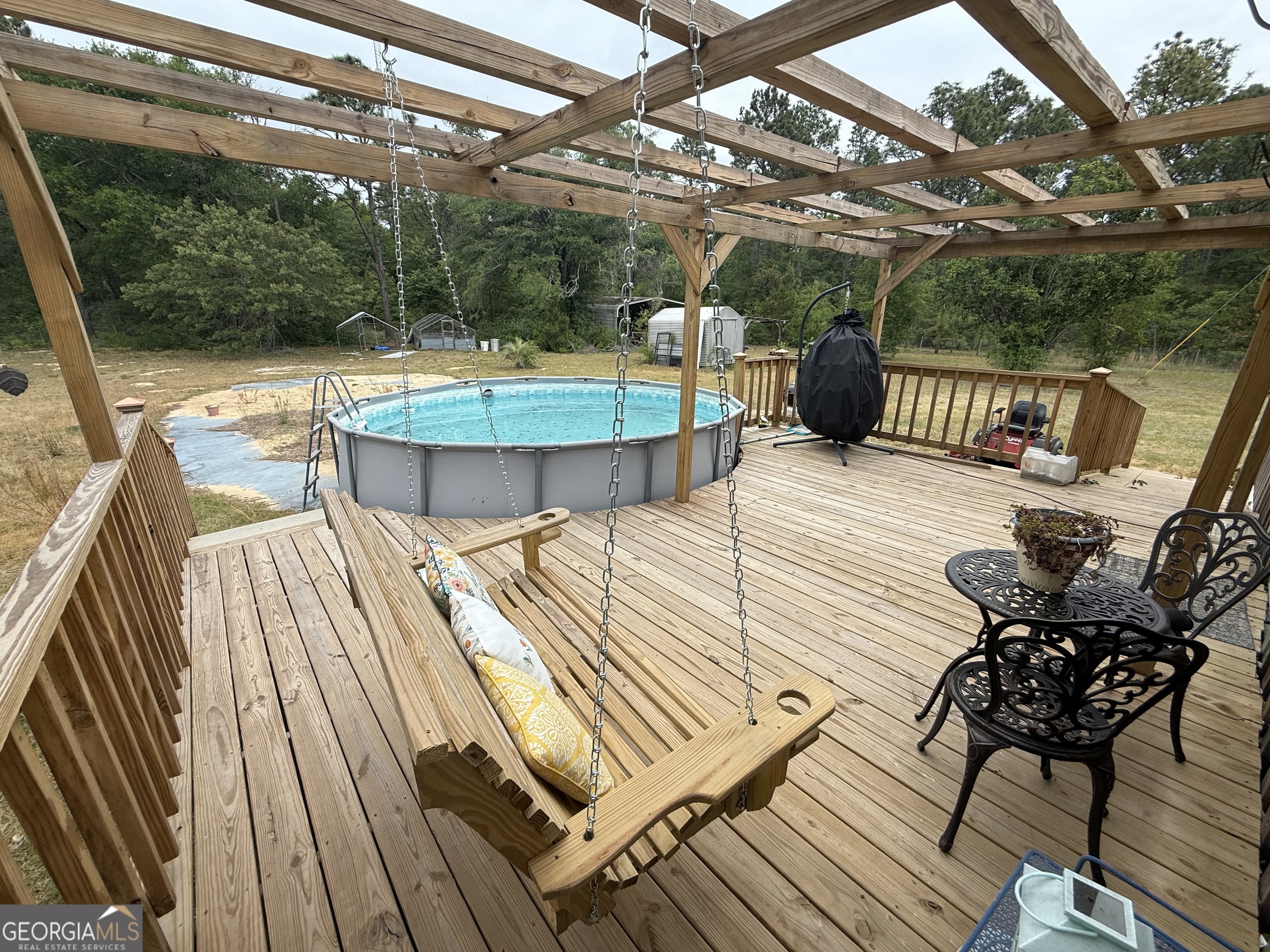 19 Cow Ford Bridge Road Adrian, GA 31002 - Photo 19 of 22 a view of a swimming pool with a patio