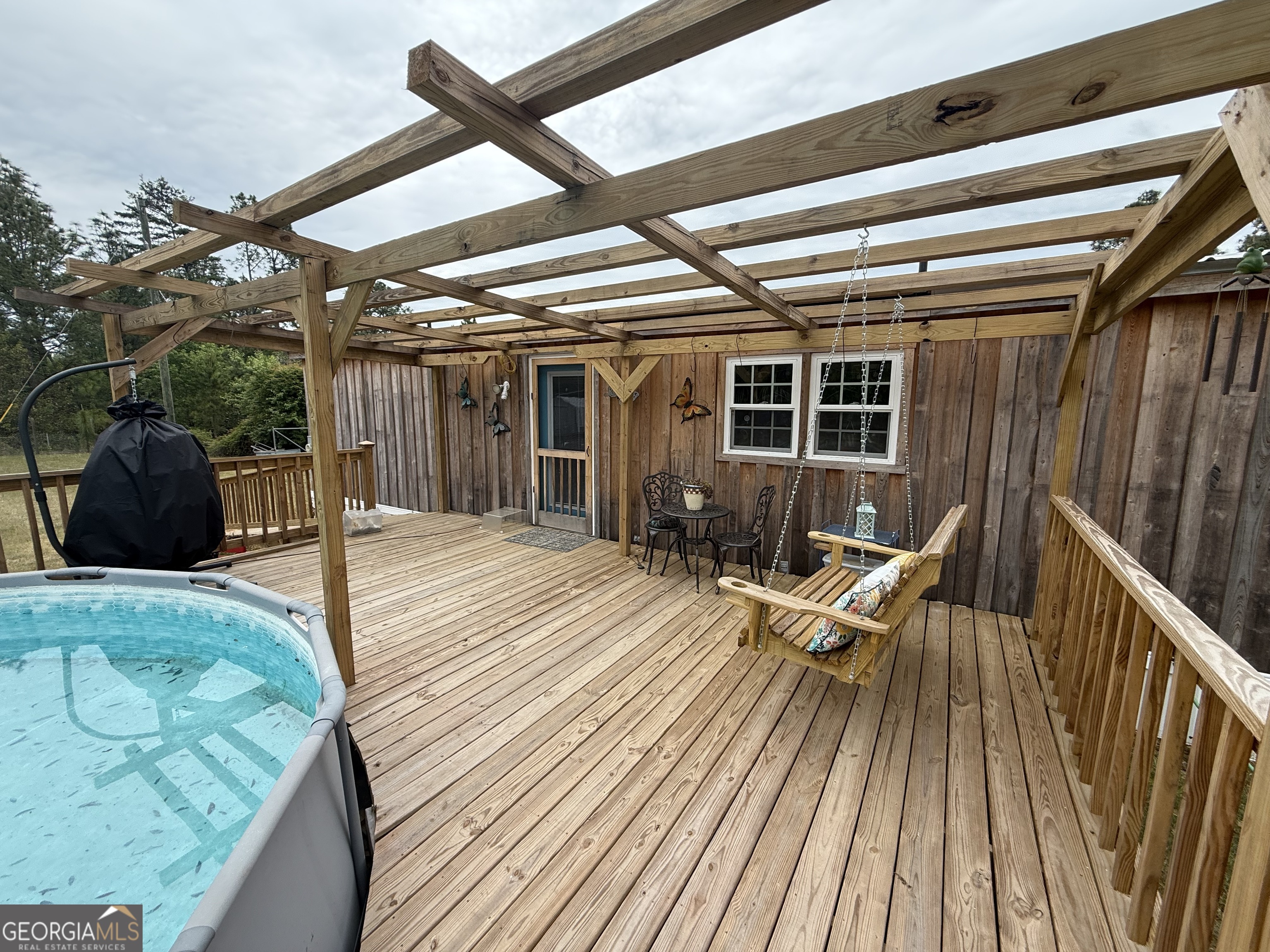 19 Cow Ford Bridge Road Adrian, GA 31002 - Photo 20 of 22 a view of a chairs on the roof deck