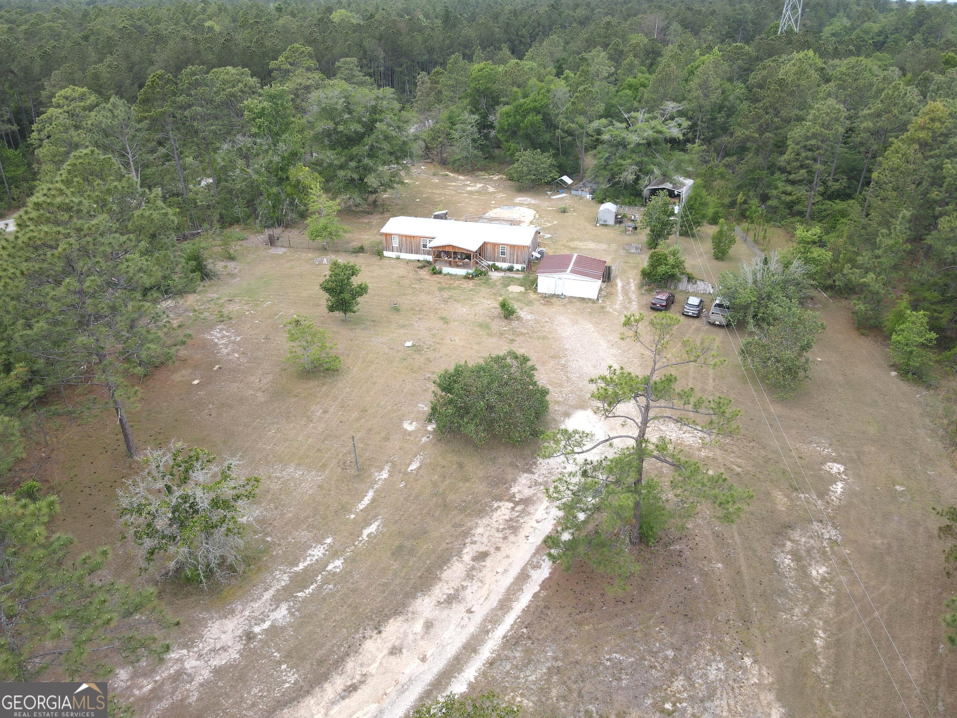 19 Cow Ford Bridge Road Adrian, GA 31002 - Photo 2 of 22 a view of a yard with trees