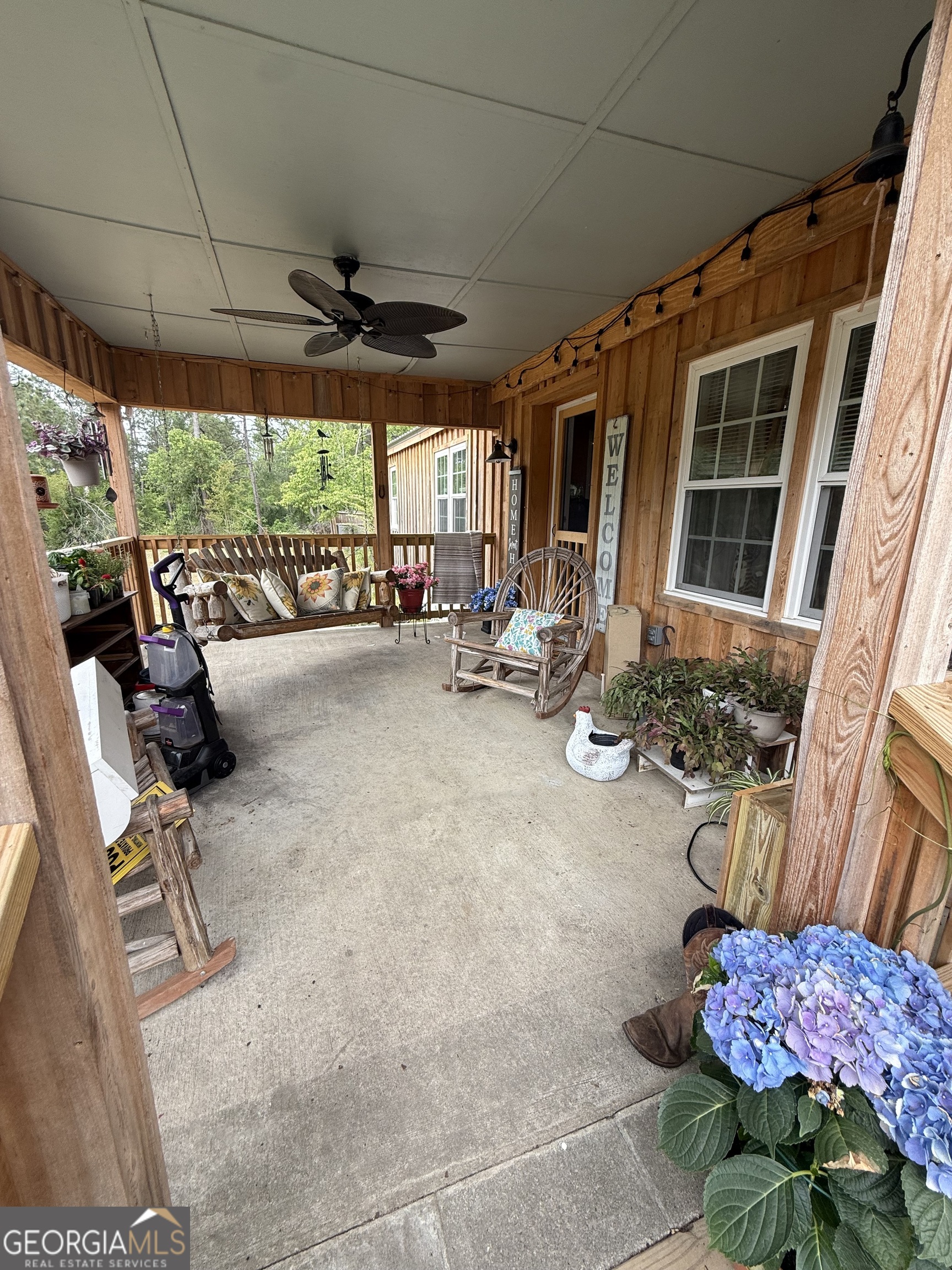19 Cow Ford Bridge Road Adrian, GA 31002 - Photo 21 of 22 a view of a chairs and table in a patio