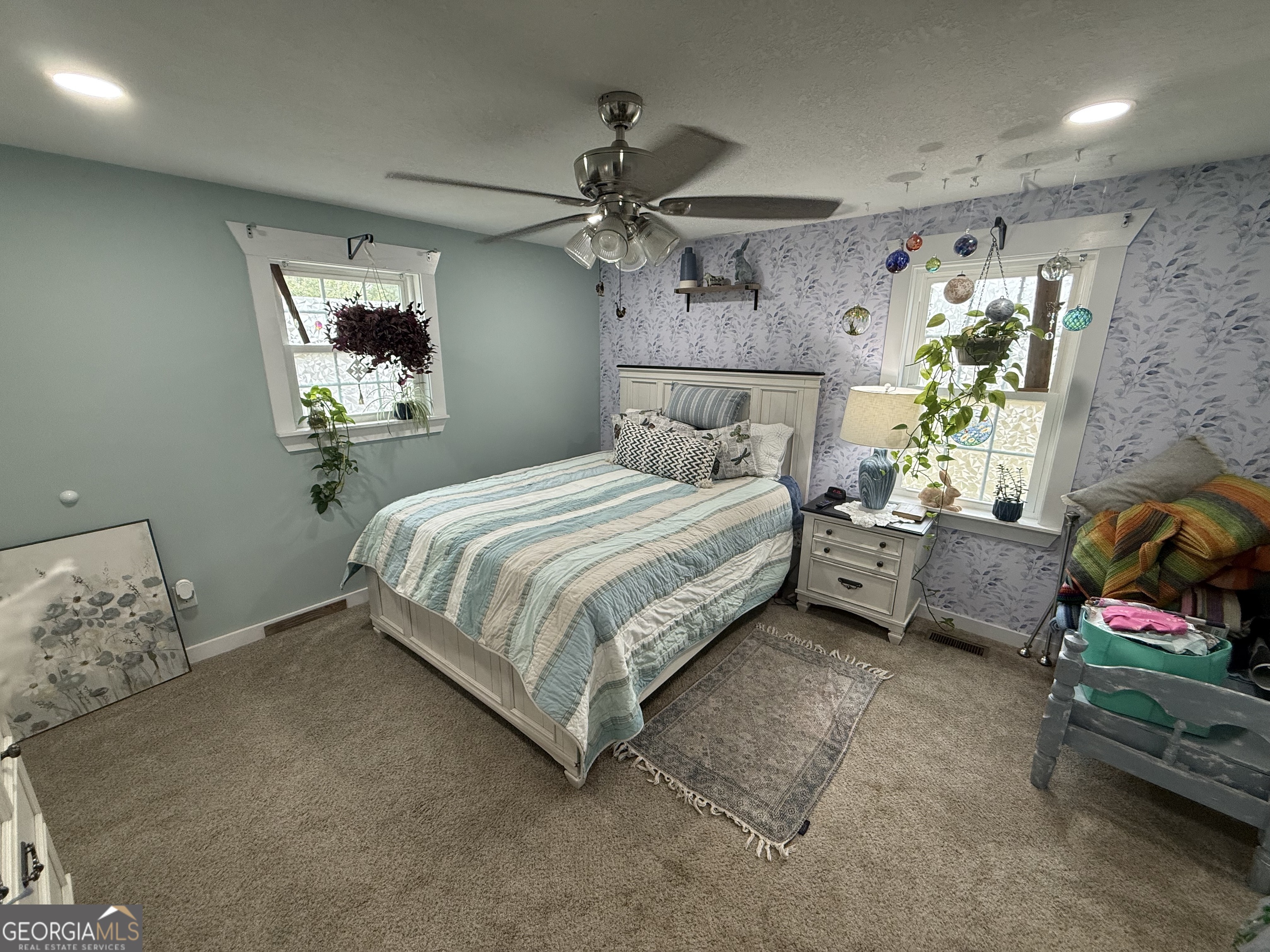19 Cow Ford Bridge Road Adrian, GA 31002 - Photo 8 of 22 a bedroom with a bed table and couch