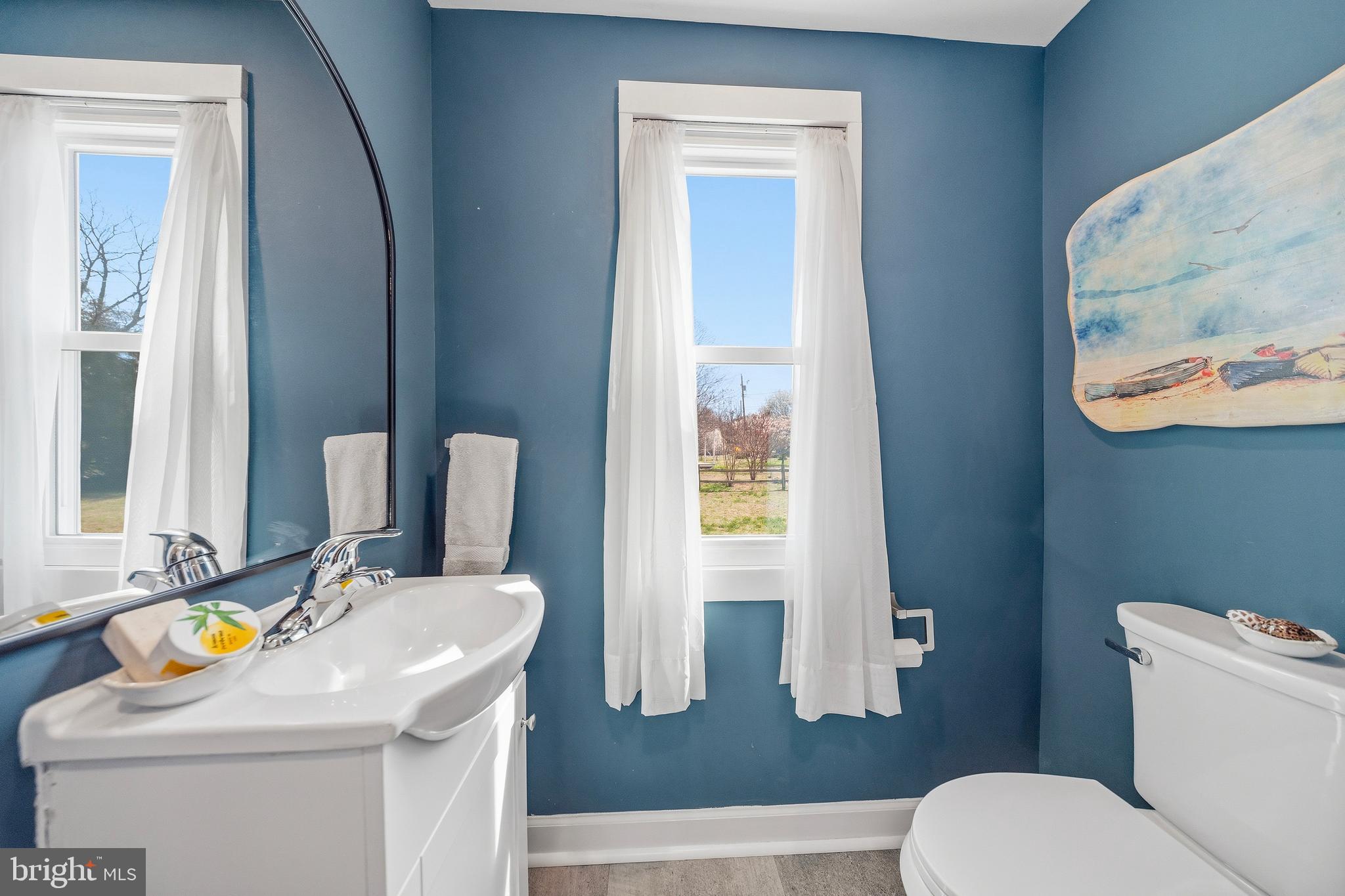 20826 Bivalve Wharf Road Bivalve, MD 21865 - Photo 22 of 52 a bathroom with a sink toilet and mirror