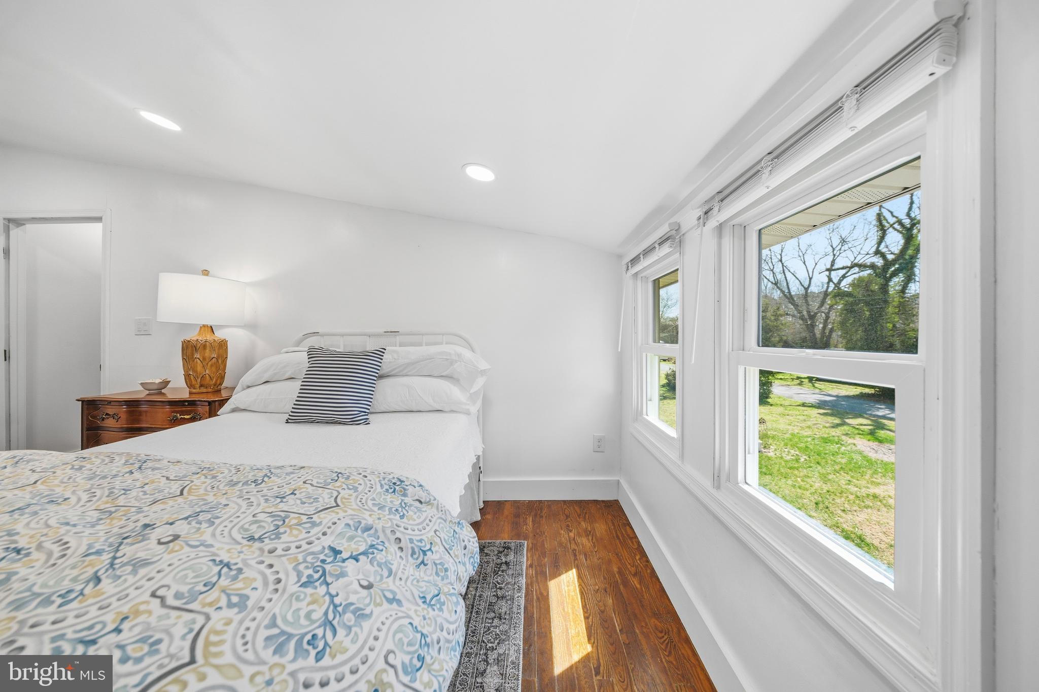 20826 Bivalve Wharf Road Bivalve, MD 21865 - Photo 29 of 52 a bedroom with a large bed and a large window