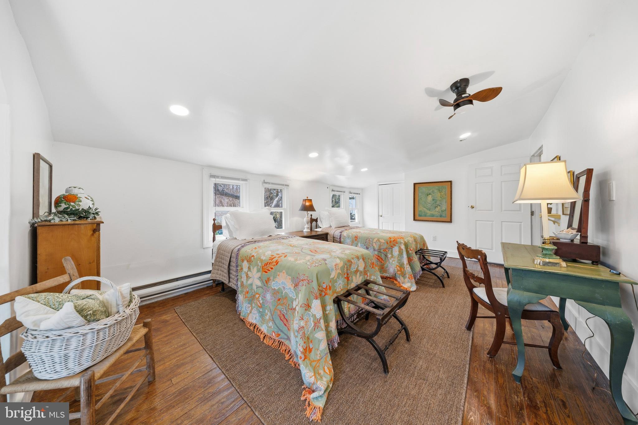 20826 Bivalve Wharf Road Bivalve, MD 21865 - Photo 33 of 52 a bedroom with a bed and chandelier
