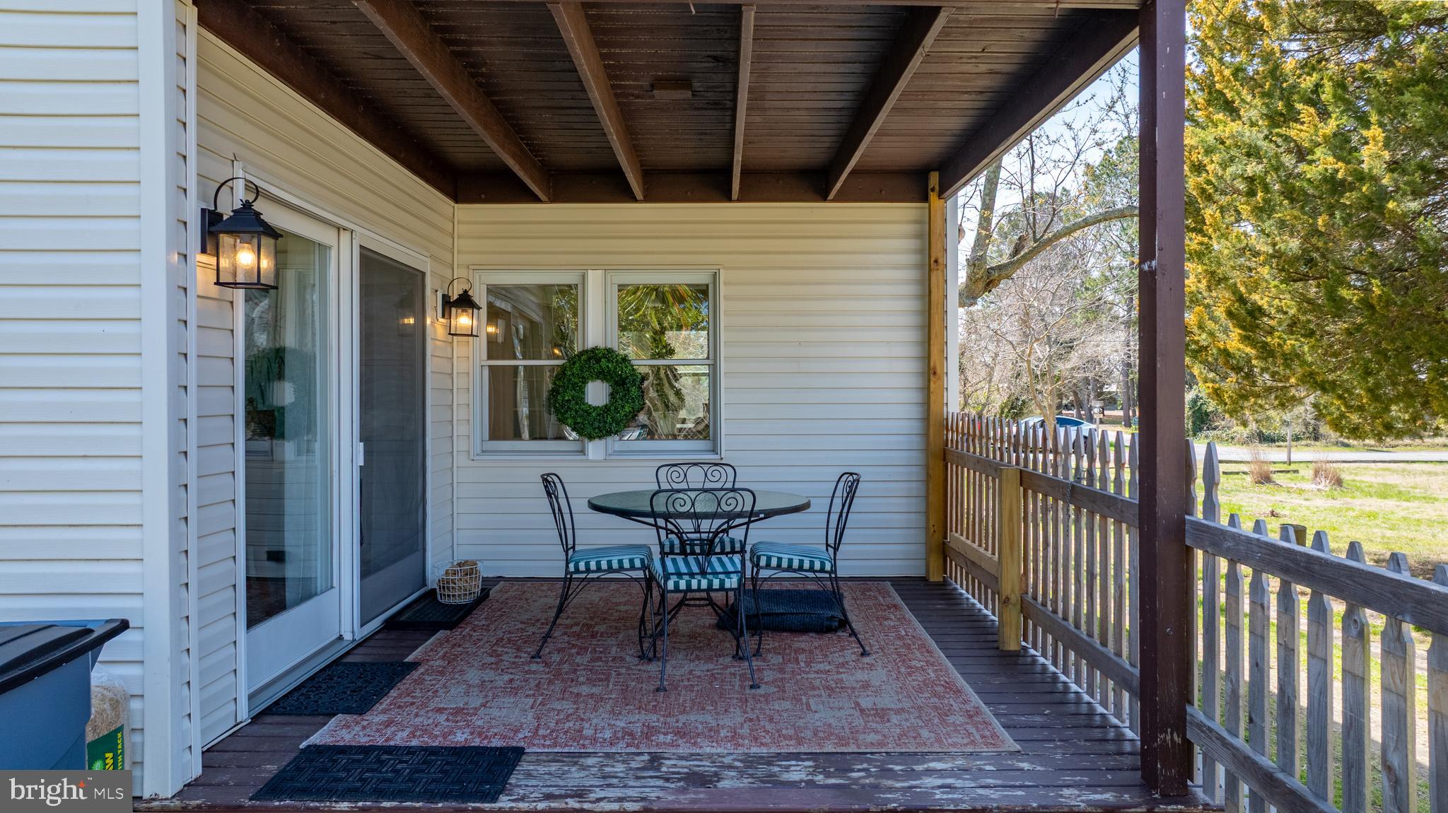 20826 Bivalve Wharf Road Bivalve, MD 21865 - Photo 45 of 52 a view of a porch with furniture and a yard
