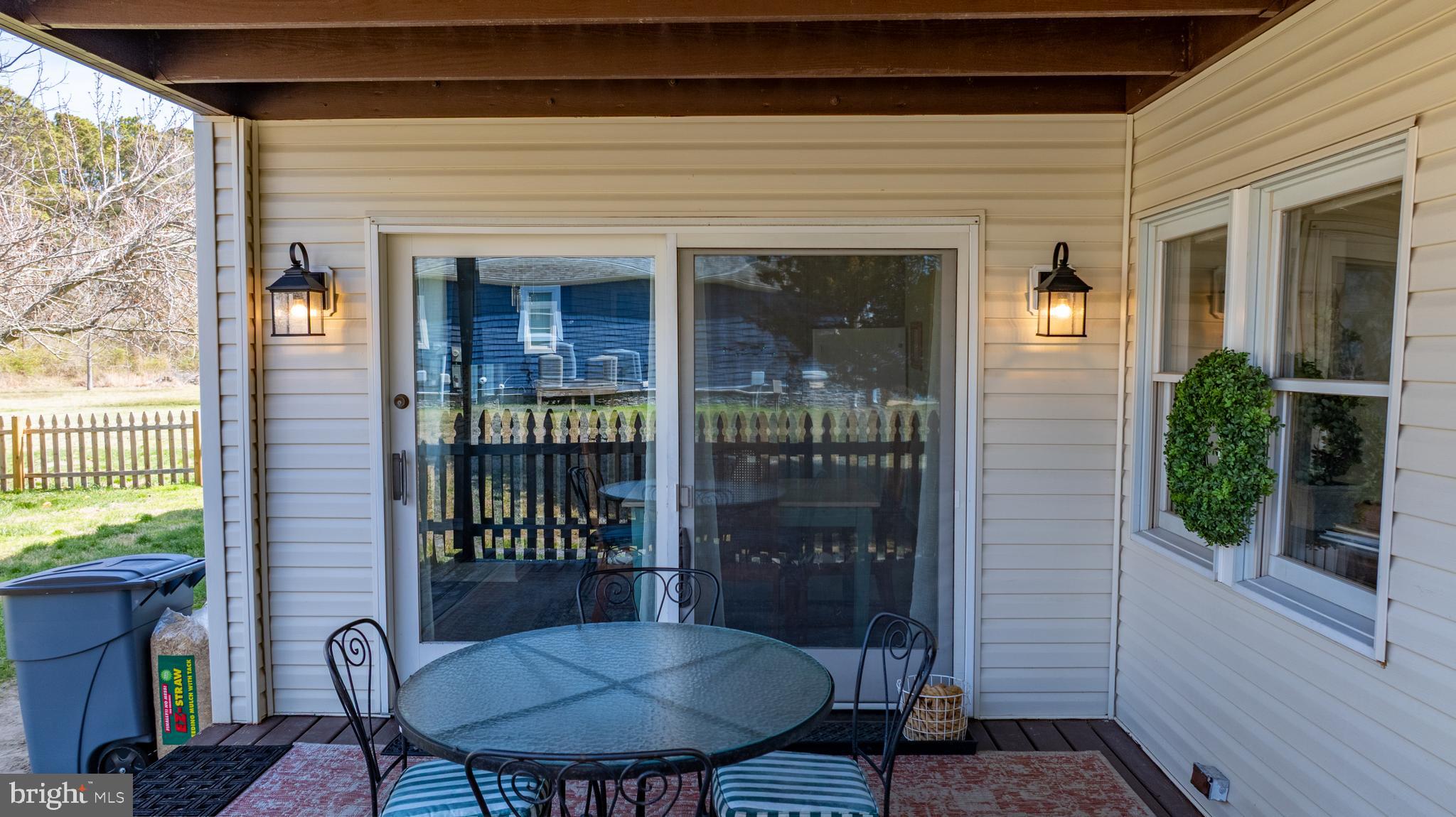 20826 Bivalve Wharf Road Bivalve, MD 21865 - Photo 46 of 52 a view of a porch with a table and chairs