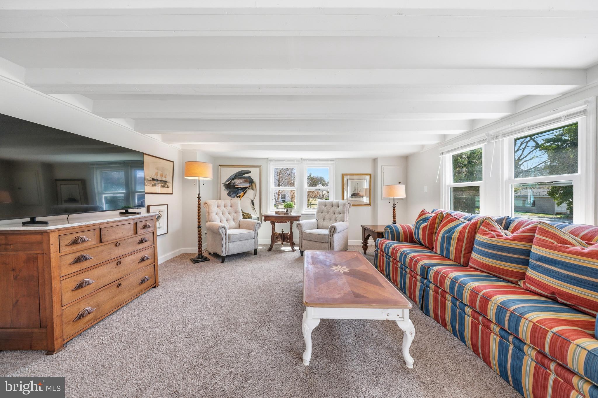 20826 Bivalve Wharf Road Bivalve, MD 21865 - Photo 7 of 52 a living room with furniture a flat screen tv and a dresser