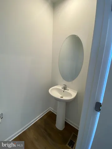 a bathroom with a sink and mirror