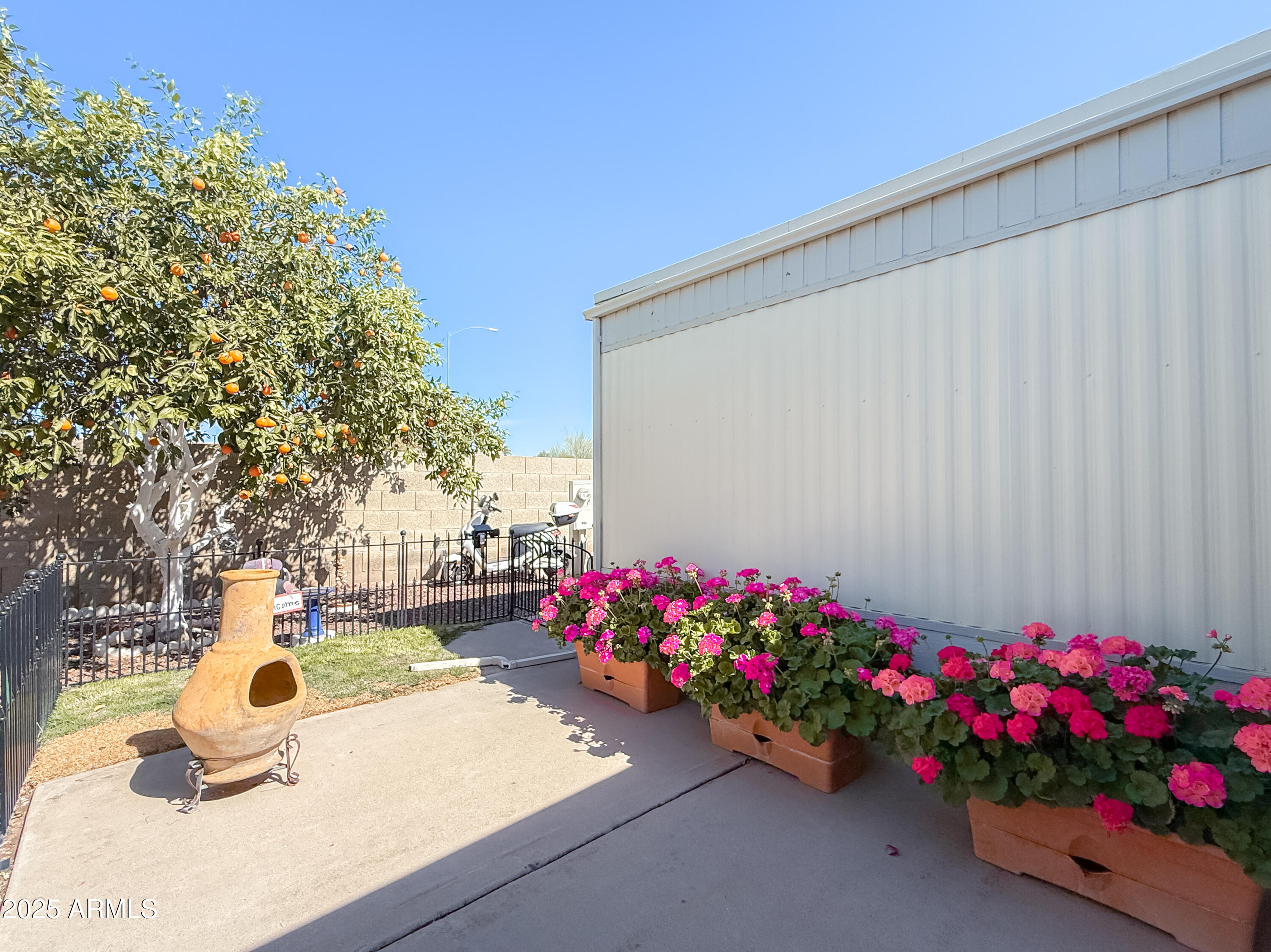 661 North Hawes Road, Unit 34 Mesa, AZ 85208 - Photo 17 of 19 Gated Back Patio w/ grass