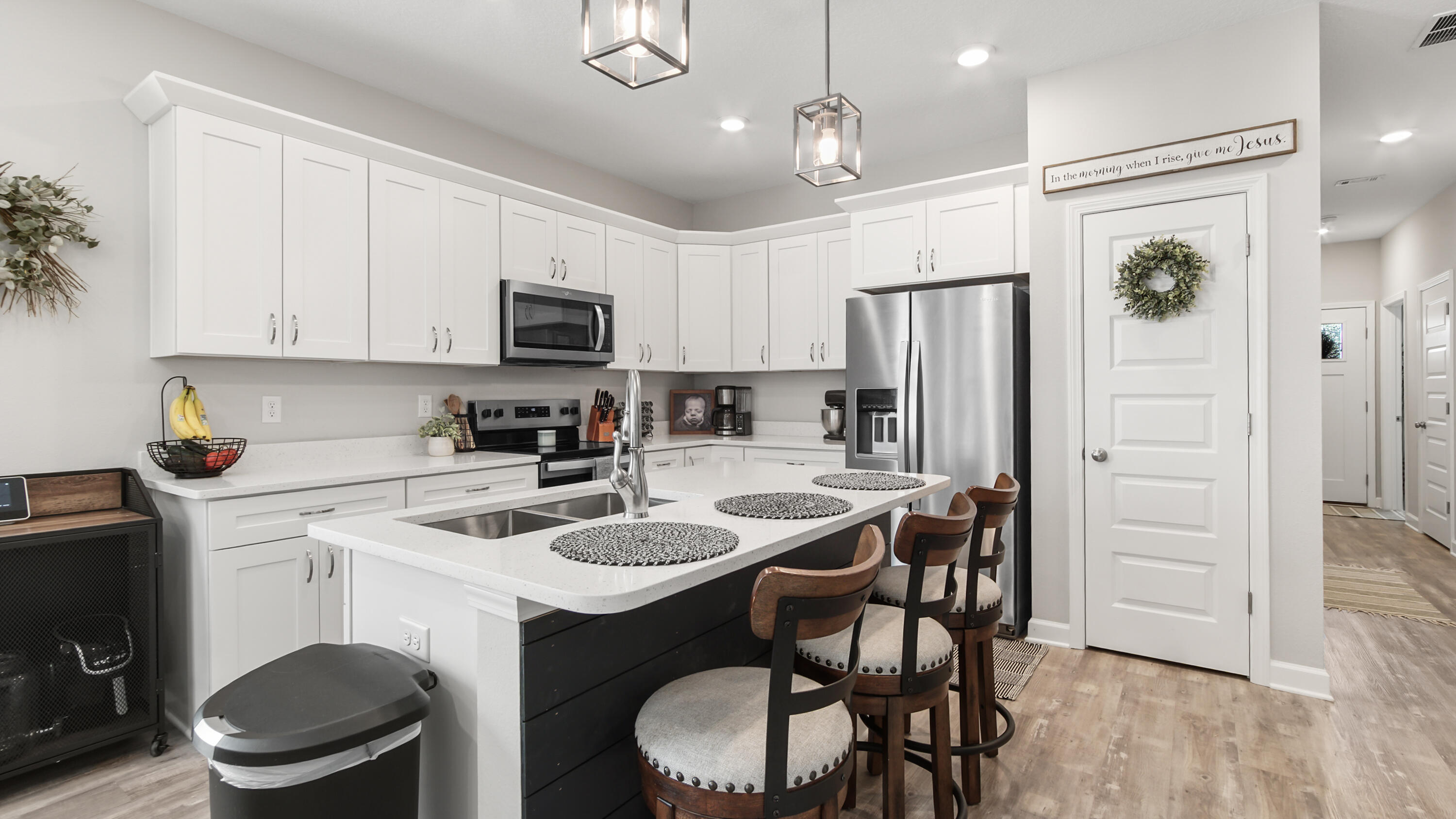 50 Jessica Court Freeport, FL 32439 - Photo 14 of 52 a kitchen with a dining table chairs and refrigerator