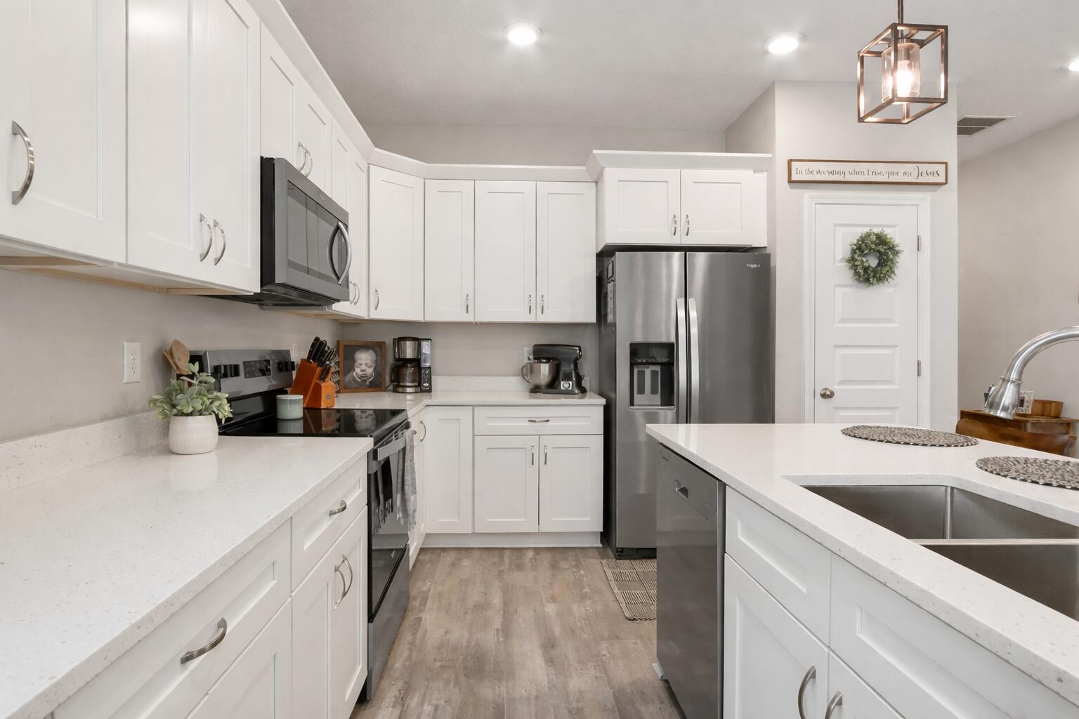 50 Jessica Court Freeport, FL 32439 - Photo 15 of 52 a kitchen with a sink a refrigerator and cabinets