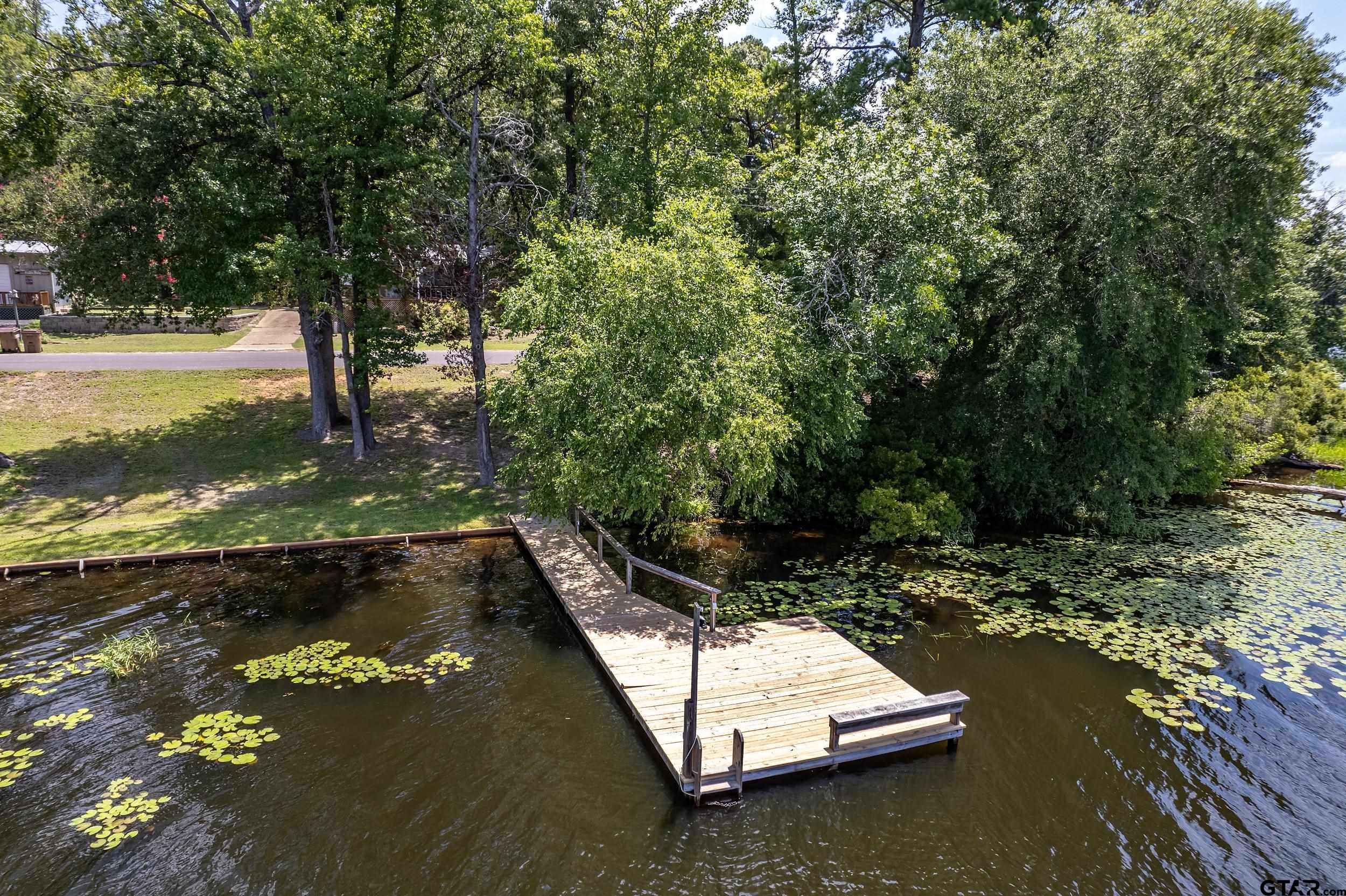 749 County Road 3420 Hawkins, TX 75765 - Photo 3 of 29 a view of a swimming pool with a yard