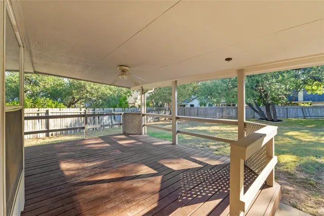 a view of a porch with wooden floor