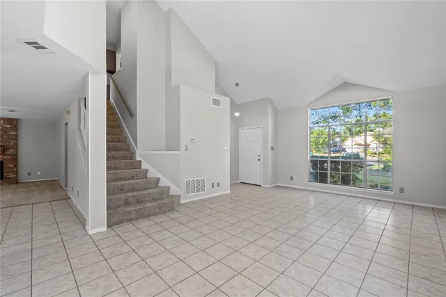 a view of entryway with wooden floor and stair