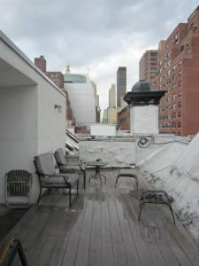a view of roof deck with seating space