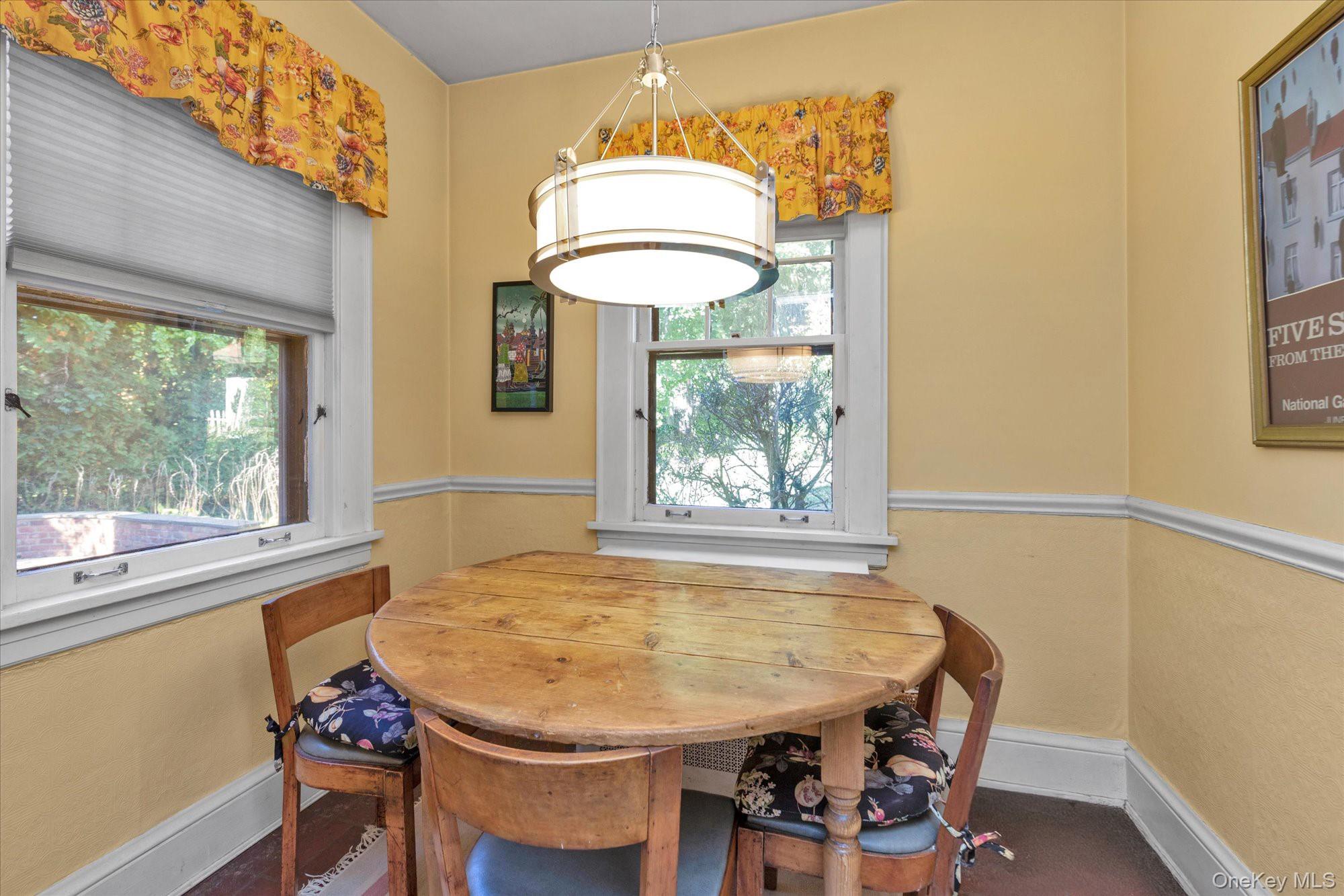 57 Beacon Hill Road Port Washington, NY 11050 - Photo 12 of 25 a view of a dining room with furniture and a window