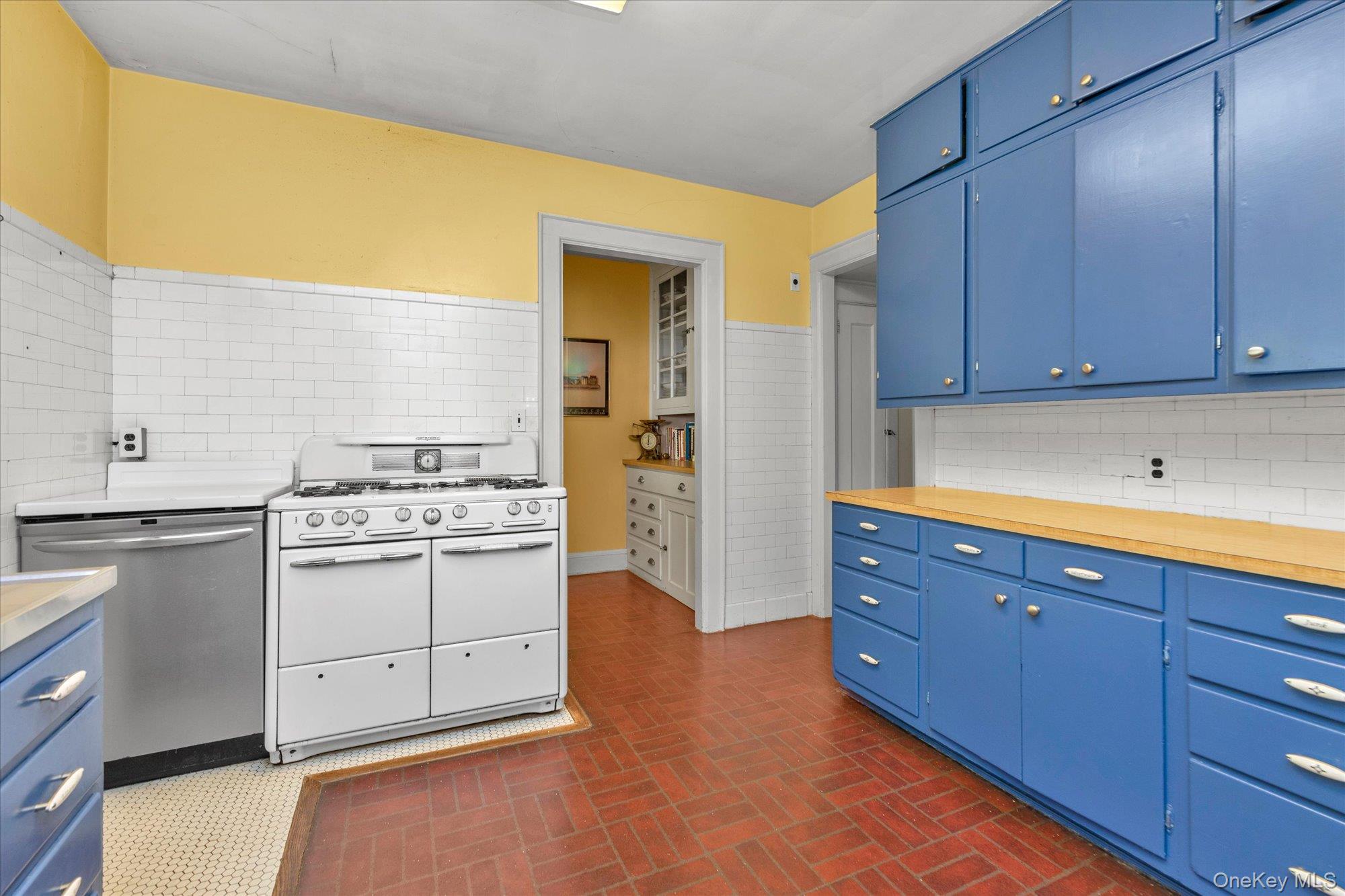 57 Beacon Hill Road Port Washington, NY 11050 - Photo 13 of 25 a kitchen with sink and cabinets