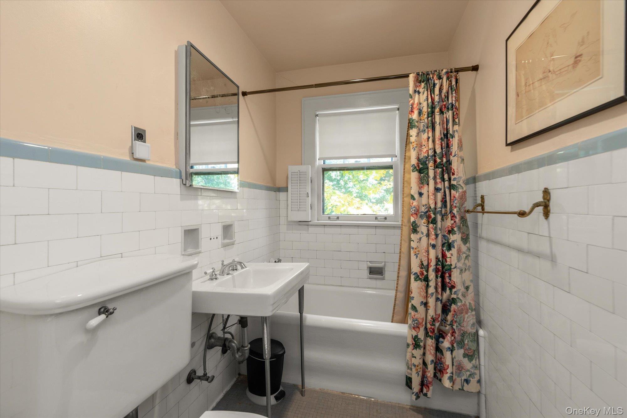 57 Beacon Hill Road Port Washington, NY 11050 - Photo 15 of 25 a bathroom with a sink and a mirror