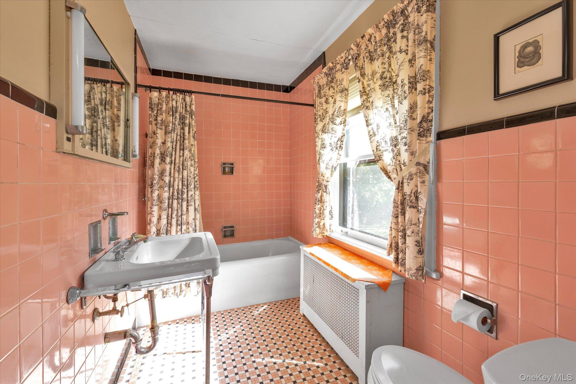 57 Beacon Hill Road Port Washington, NY 11050 - Photo 17 of 25 a living room with furniture and a window