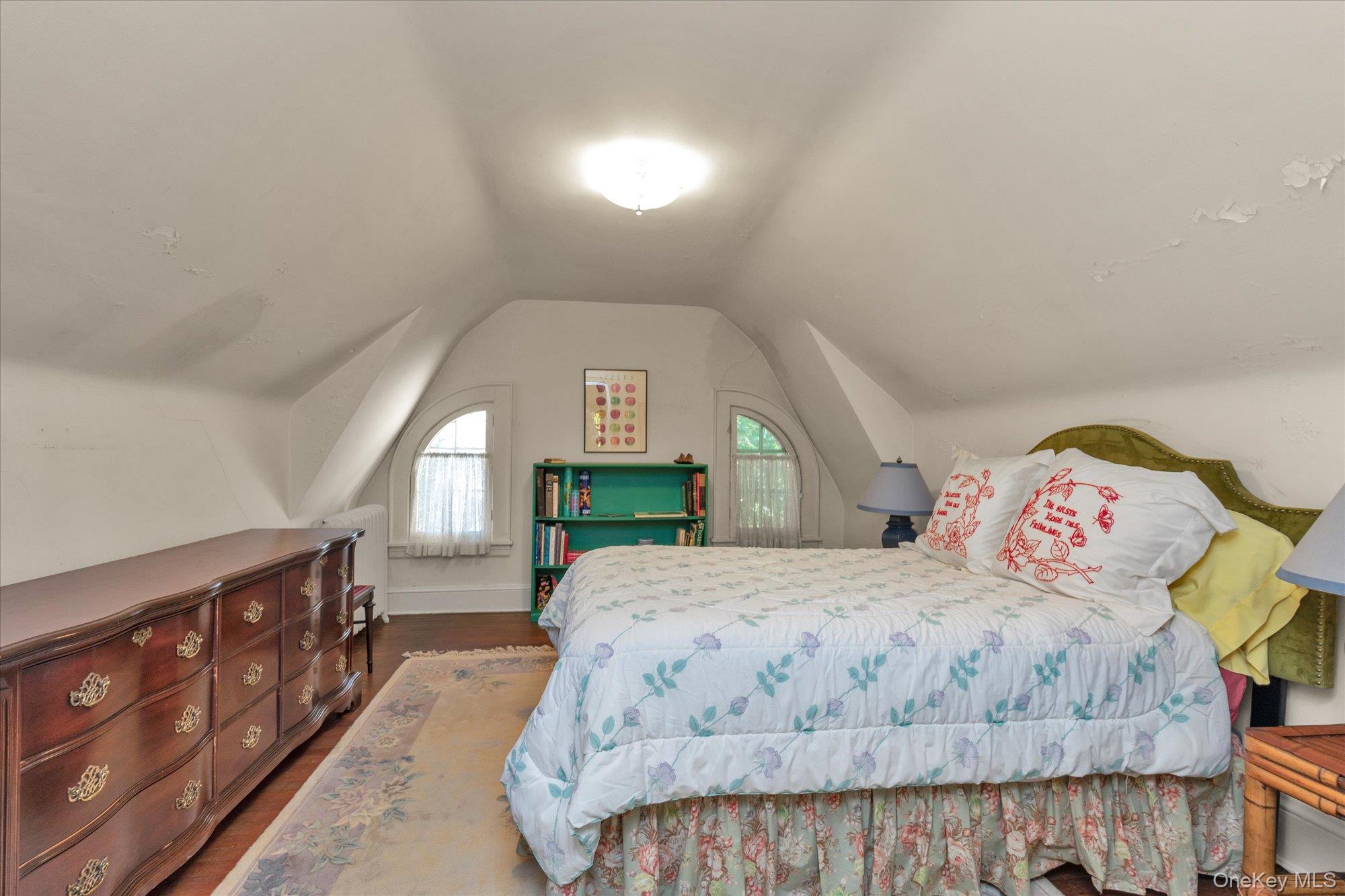 57 Beacon Hill Road Port Washington, NY 11050 - Photo 21 of 25 a bedroom with a bed a dresser and window
