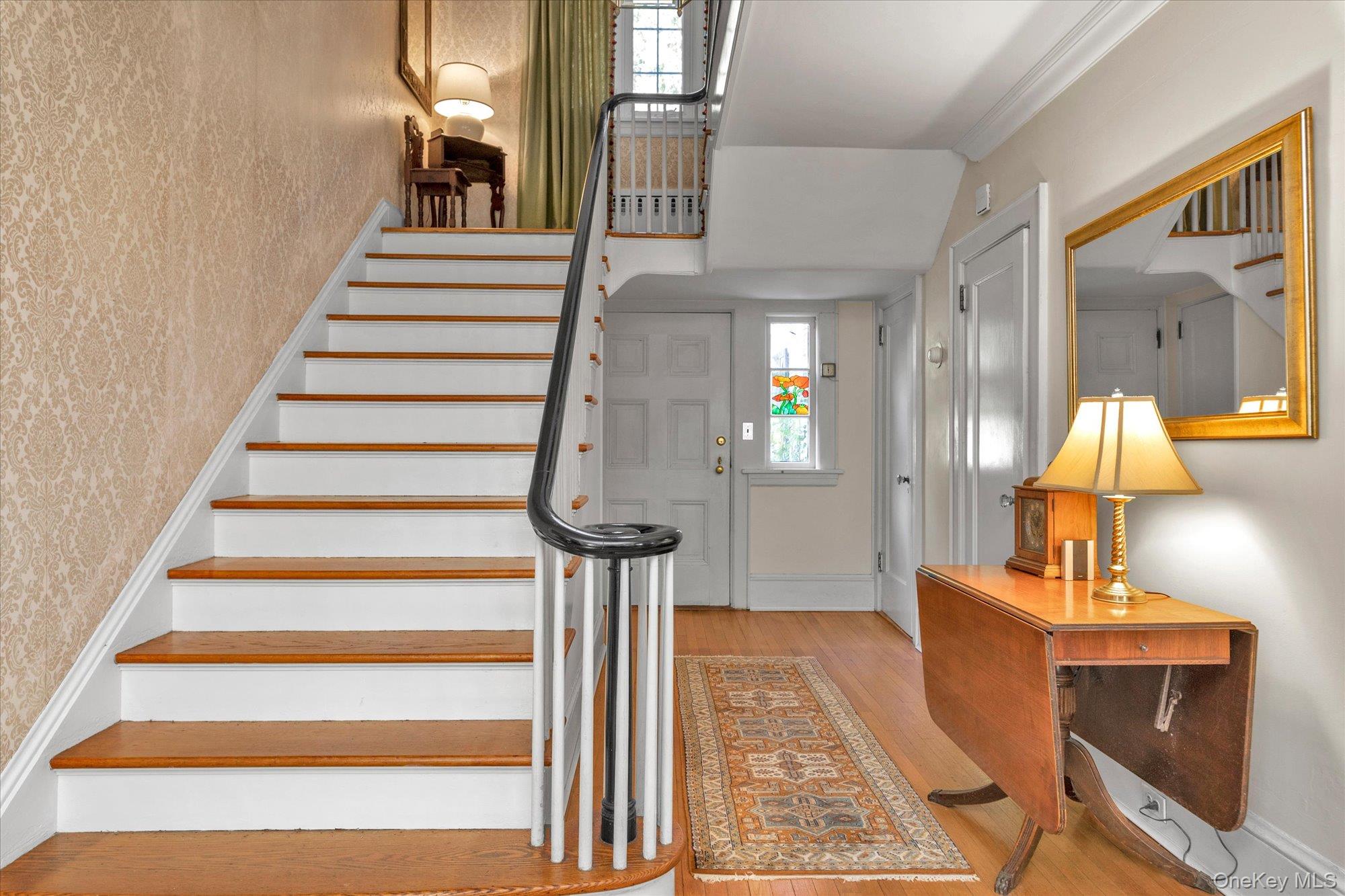 57 Beacon Hill Road Port Washington, NY 11050 - Photo 6 of 25 a view of entryway and hall with wooden floor