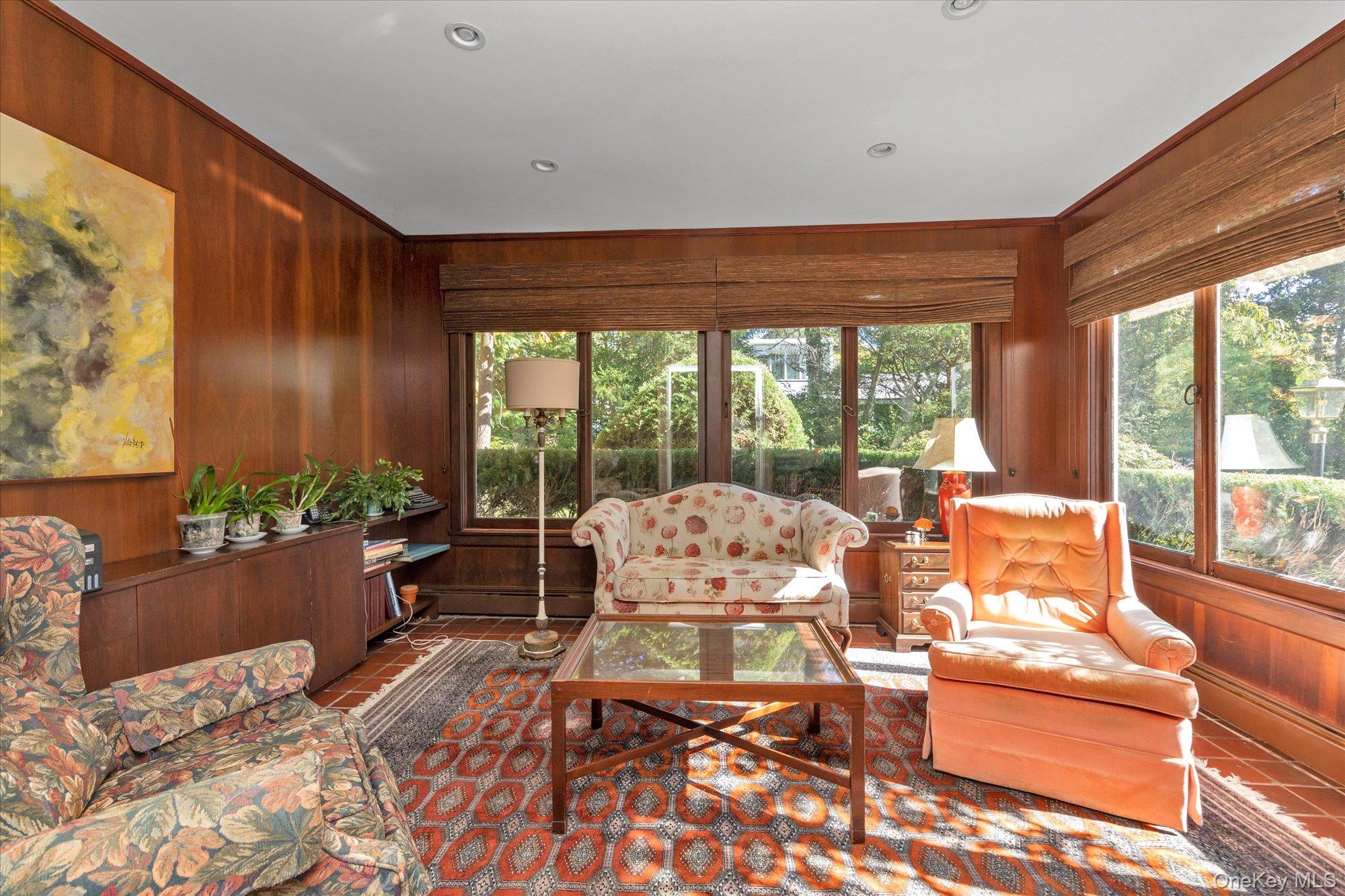 57 Beacon Hill Road Port Washington, NY 11050 - Photo 9 of 25 a living room with furniture and floor to ceiling windows