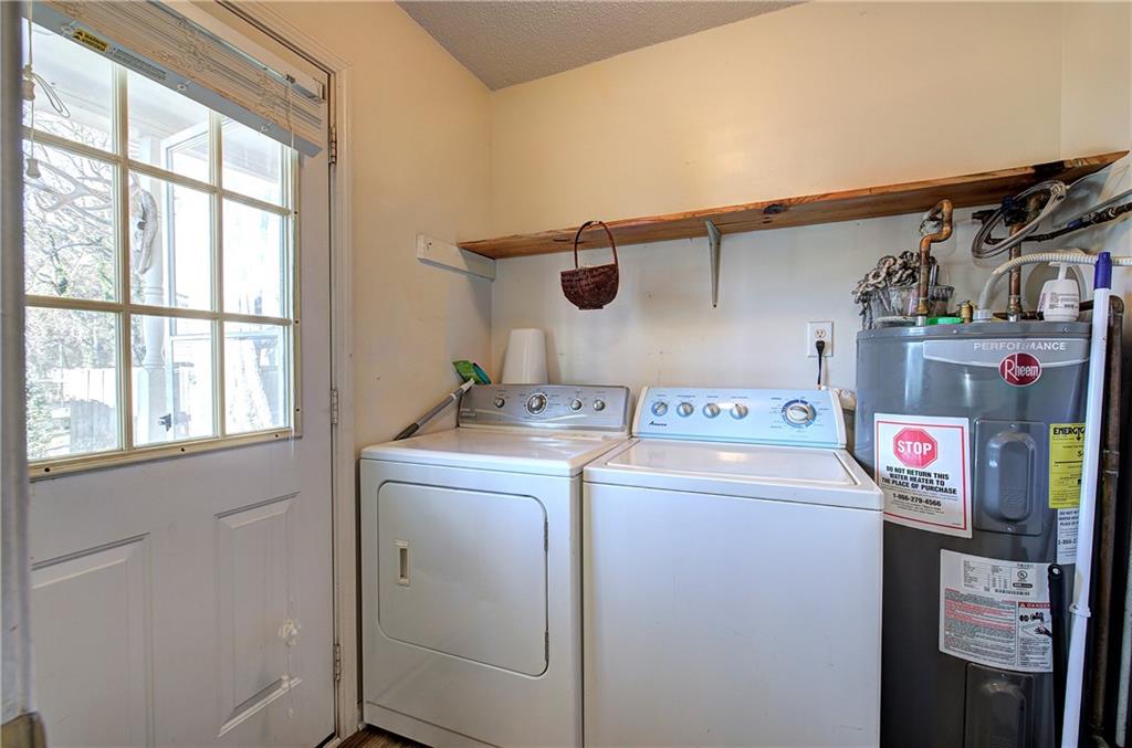302 Douglas Street Cartersville, GA 30120 - Photo 17 of 29 a utility room with dryer and washer