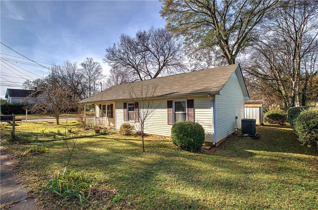 302 Douglas Street Cartersville, GA 30120 - Photo 2 of 29 a view of a house with swimming pool next to a yard