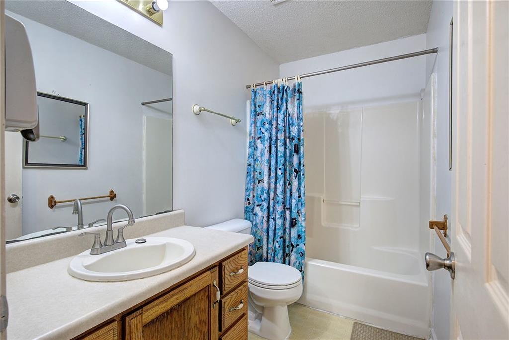 302 Douglas Street Cartersville, GA 30120 - Photo 23 of 29 a bathroom with a sink toilet and shower