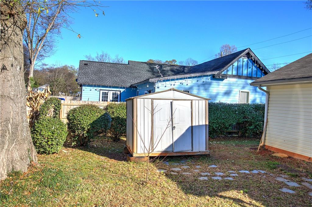 302 Douglas Street Cartersville, GA 30120 - Photo 25 of 29 a view of a house with wooden fence