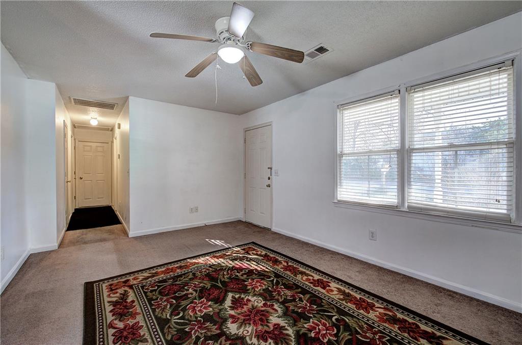 302 Douglas Street Cartersville, GA 30120 - Photo 5 of 29 a view of an empty room with a window