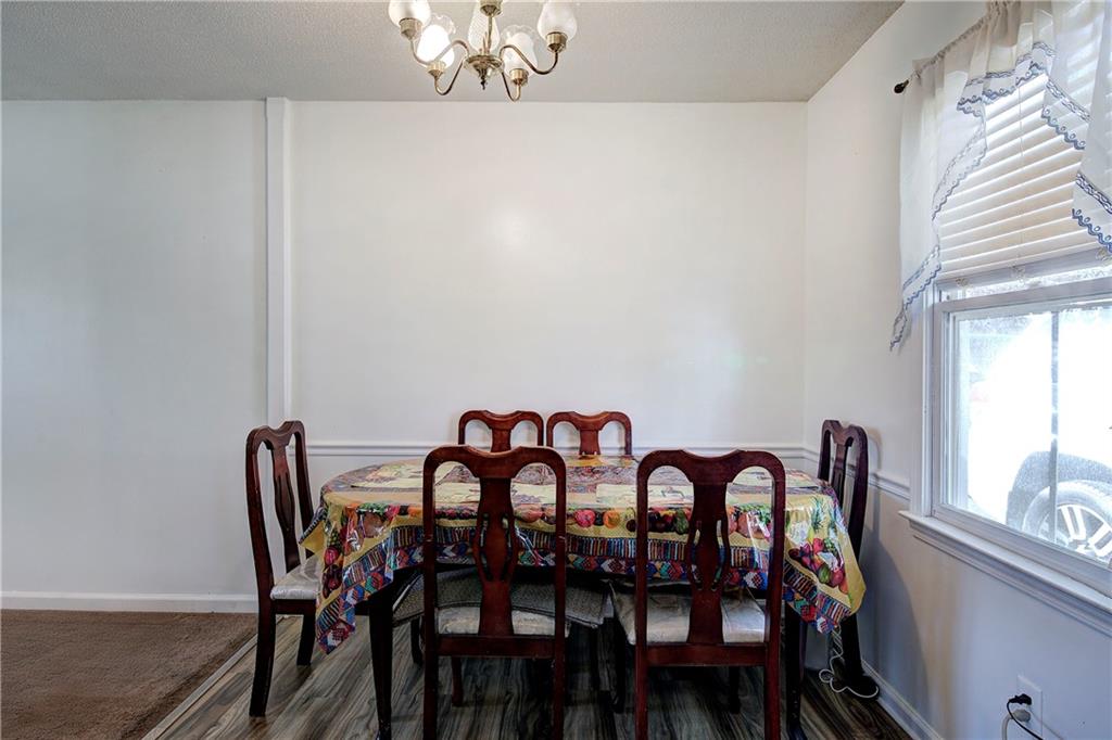 302 Douglas Street Cartersville, GA 30120 - Photo 9 of 29 a view of a dining room with furniture and window